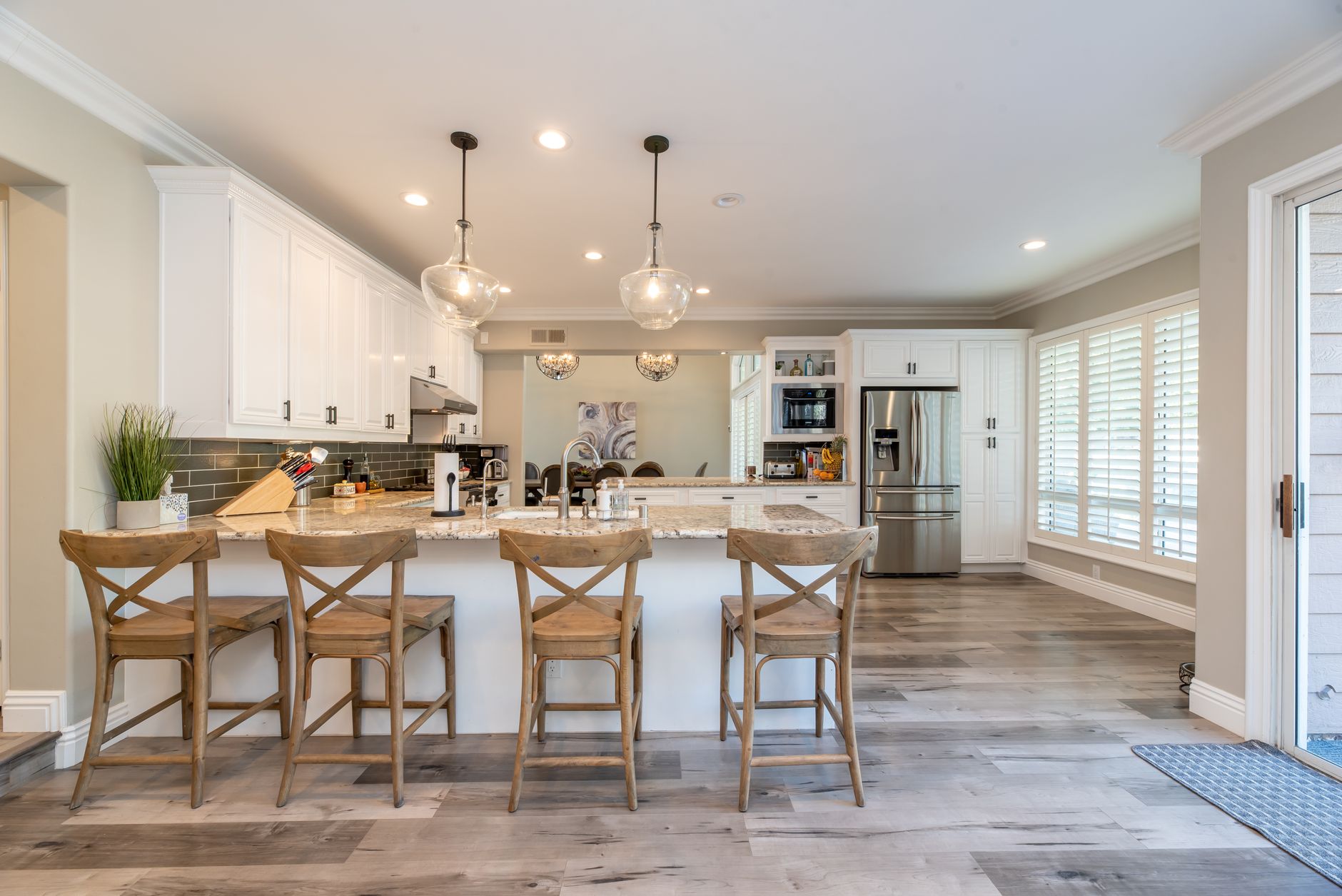Bright and spacious kitchen interior featuring bar stools and modern design elements in Irvine, CA