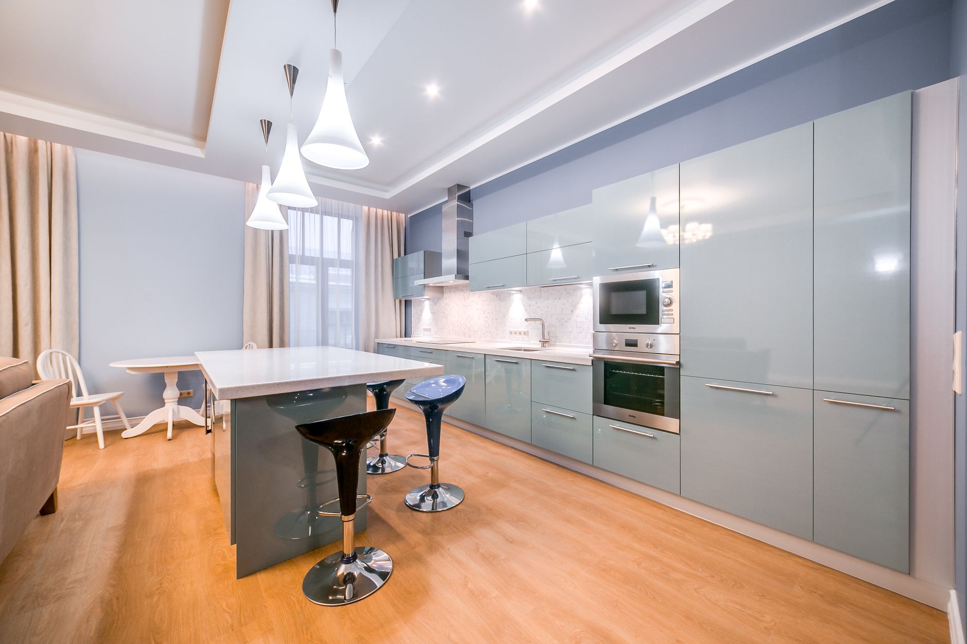 Spacious minimalist kitchen with sleek cabinets and modern lighting in Irvine, CA