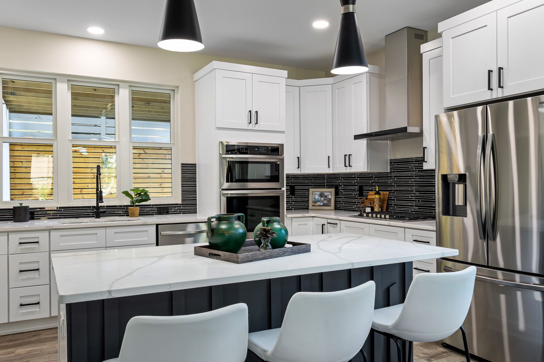 Sleek modern kitchen with a marble island, stainless steel appliances, and stylish decor in Irvine, CA